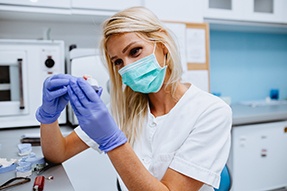 Dental technician in Dallas working on dentures