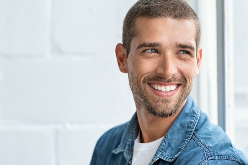 person wearing temporary veneers and smiling