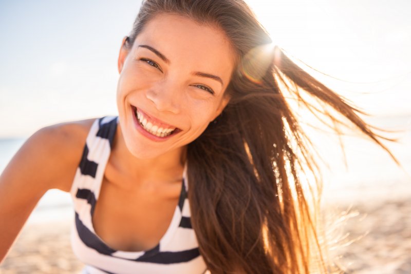 Smiling person in a summery location