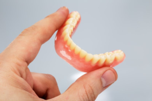 a closeup of a lower denture